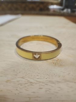 Gold-Tone Bangle Bracelet with Heart Cutout