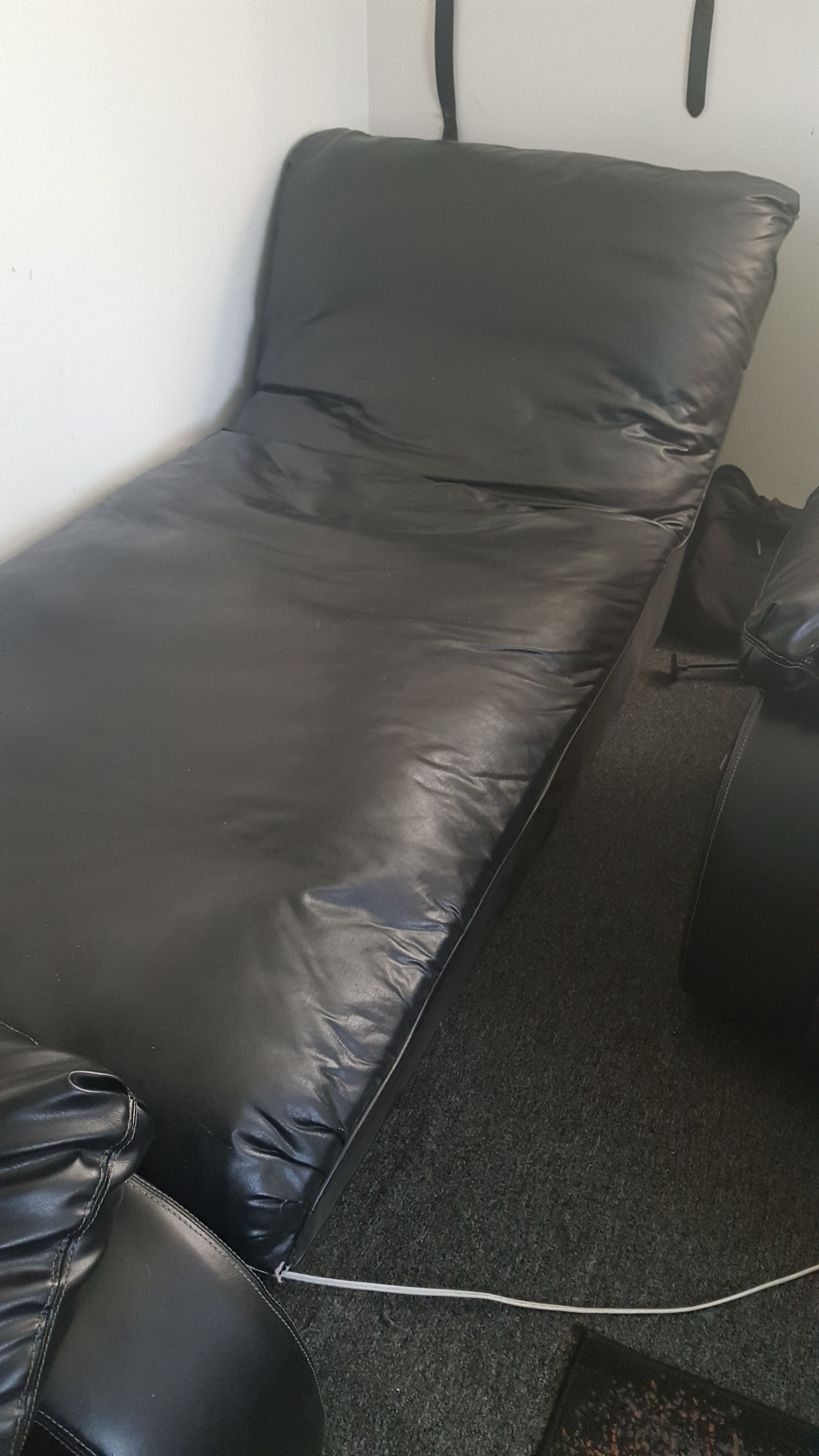 Black leather lounge chair