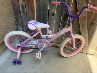 Pink  and purple Huffy Disney Princess kid's bike with 16-inch wheels and included training wheels