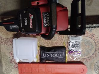 5800 Homdox professional chain saw with extra chain and tool kit. Also blade cover and 2 cycle gas container.