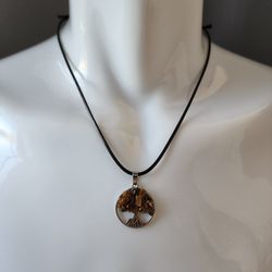 Astra – Tree of Life Tiger’s Eye Pendant, Adjustable Brown Rope Necklace

Astra is a round Tree of Life pendant featuring a cutout metal design with p