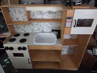 Large, solid wood play kitchen