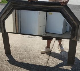What a unique octagonal mirror! Its distressed frame could add a rustic touch to any room. Want to find more photos of your home decor?