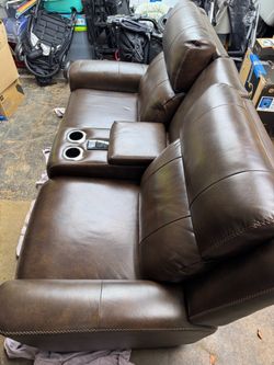 Reclining leather sofa
