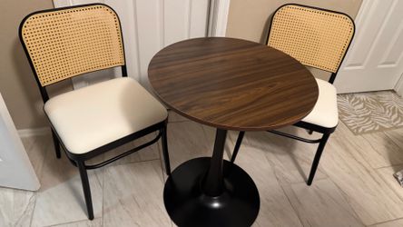 Round table with two chairs