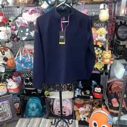 NWT Under Armour Ladies Golf Top Size S. Blue with Pink Accents long sleeve.