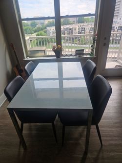 White Glass Top Dining Table with 4 Black Chairs