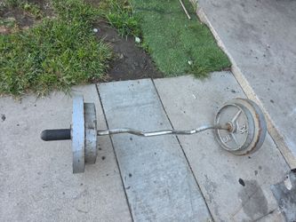 Barra de pesas  más 120 libras a$100 dlls