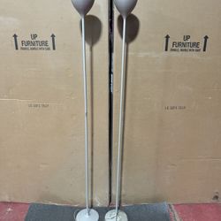 Drink F1. Floor lamp in chromed or painted metal; many finish choices available. Simple and iconic design suggests a chalice shape, filled with light.