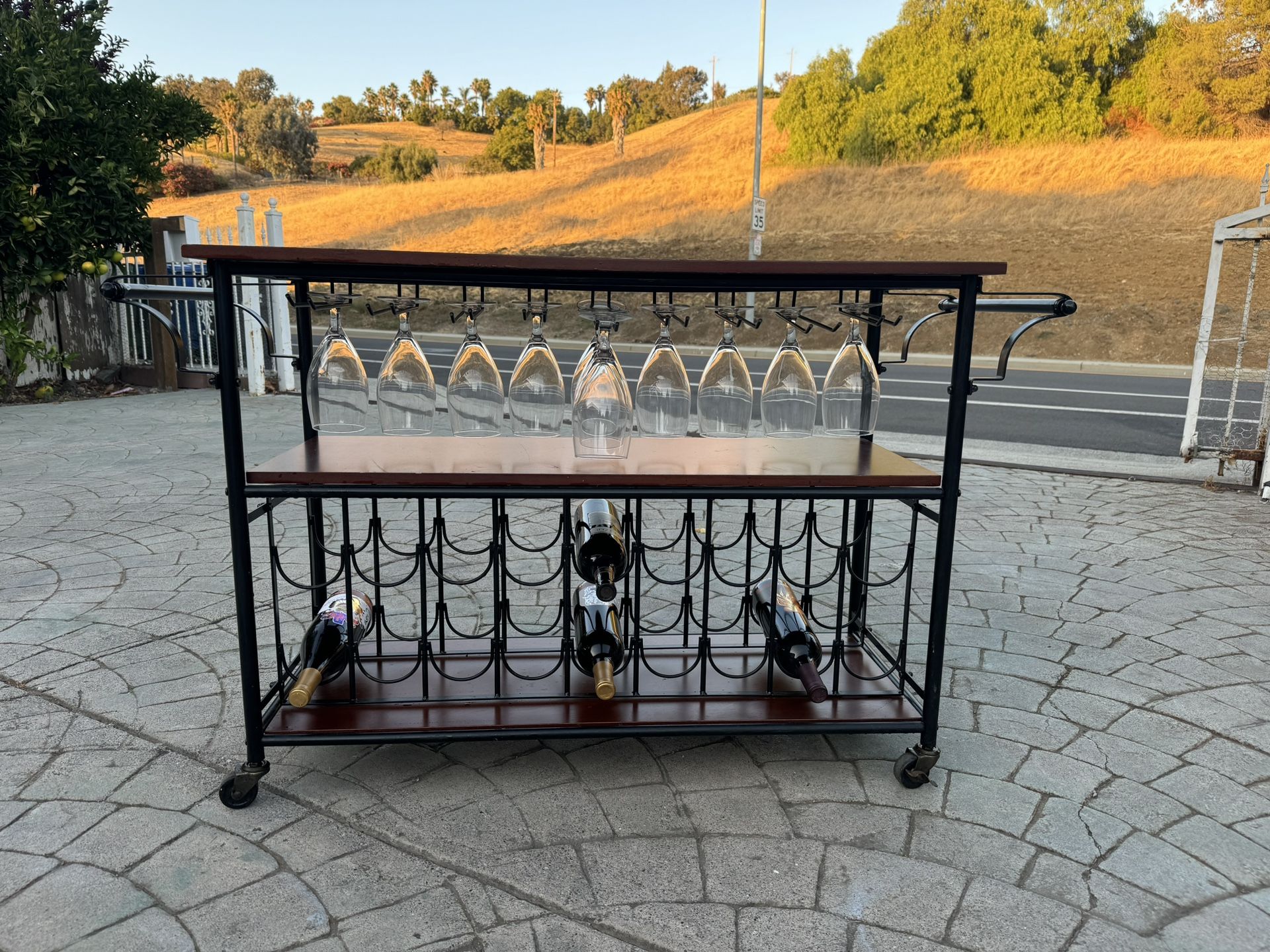 Wine table with wine glass shelving and wine bottle shelves