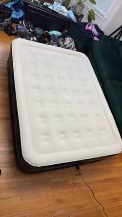 Used once. Inflatable Air Mattress with Built-In Pump Queen size