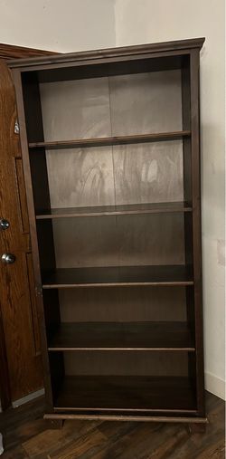 Tall wooden book shelf