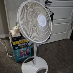 3 White Floor Fans. 2 Black Floor Fans