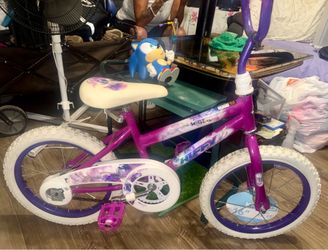 Preowned but barely used .Huffy 16" Sea Star Kids' Bike - Purple, 42" -48” riders . In great condition no longer does it have training wheels. Located