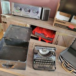 Cd player, type writer, boxes, monitor