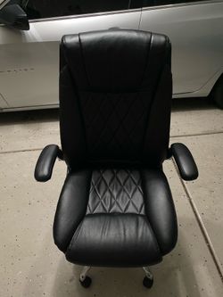 Black leather chairs with rolls