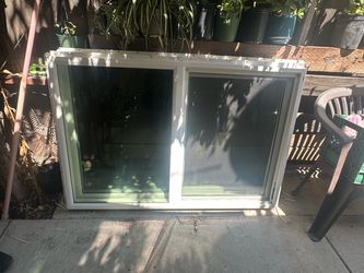 White Vinyl Sliding Window –