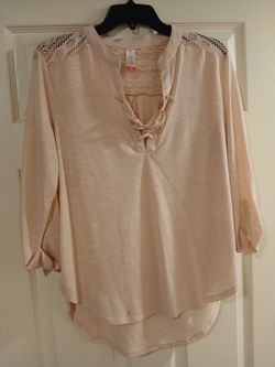 Woman's pink long-sleeve blouse