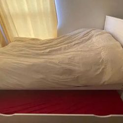 Coaster Brand White Twin Bed with twin trundle.