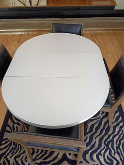 Oval expandable wood table 42x59" with 4 natural leather chairs