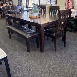 Dining Set With Butterfly Leaf With 4 Chairs And A Bench By Ashley furniture 