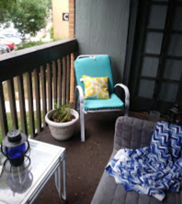 Patio furniture...two chairs and couch with cushions, table and standing planter