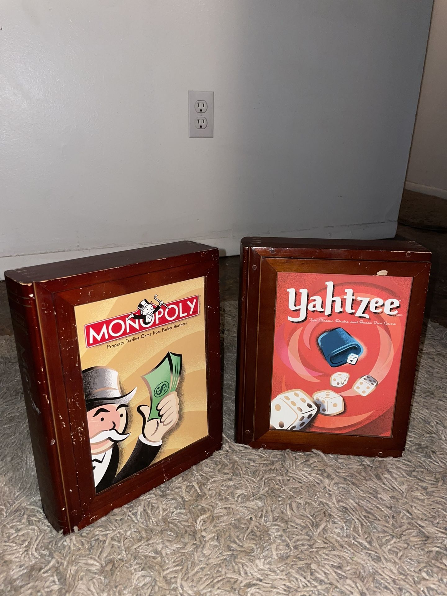 Vintage Monopoly (unopened) and Yahtzee games in collectors wooden book case