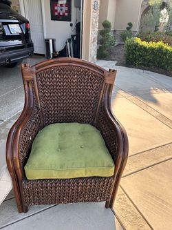 Dark Brown Wicker Accent Chair with Green Cushion