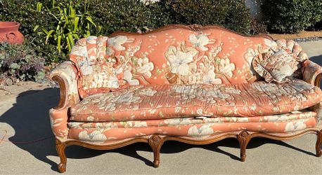 Floral sofa with wood accents