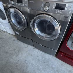 Graphite Steel Front Load Samsung Washer And Dryer With Pedestals  working perfectly extra for delivery same day delivery and installation available
