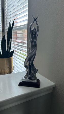 Beautiful silver ceramic statue with a graceful design. 15”
