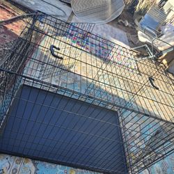 LARG  NEW CAGE FOR ANIMAL NEVER USED 48 TOOLAND 30 WIADE AND 33 HIGHT AND 2 DOORS VERY CLEEN 