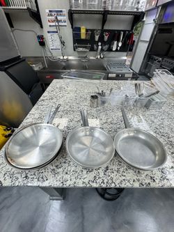 Nine 10" aluminum fry pans