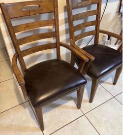 Pair of solid wood arm chairs