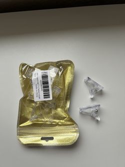 open pack of tweezer clamps 