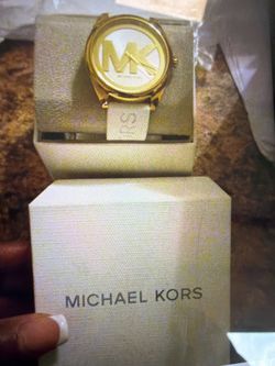 Mk watches black, white and a gold one