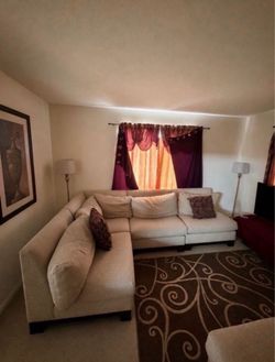 beige sectional L shaped couch