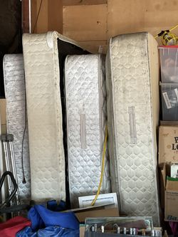 Assortment Of Mattresses And Box Springs