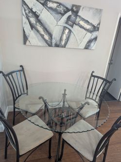 Bronze City Furniture round glass table and chairs