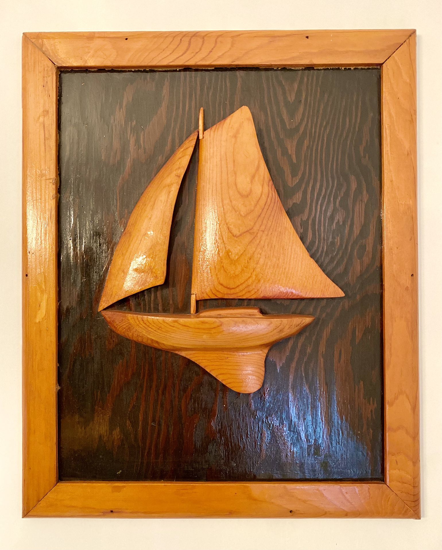 Vintage wood carving of a Star Sailboat