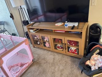 Two couches  with tv stand.