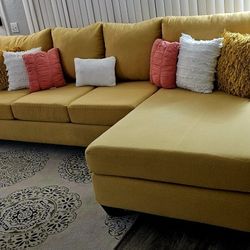 Like new! LIVING SPACES large yellow sectional sofa, 2 pieces 124" x 68" excellent sleeping area! All covers are removable for washing. Delivery avail