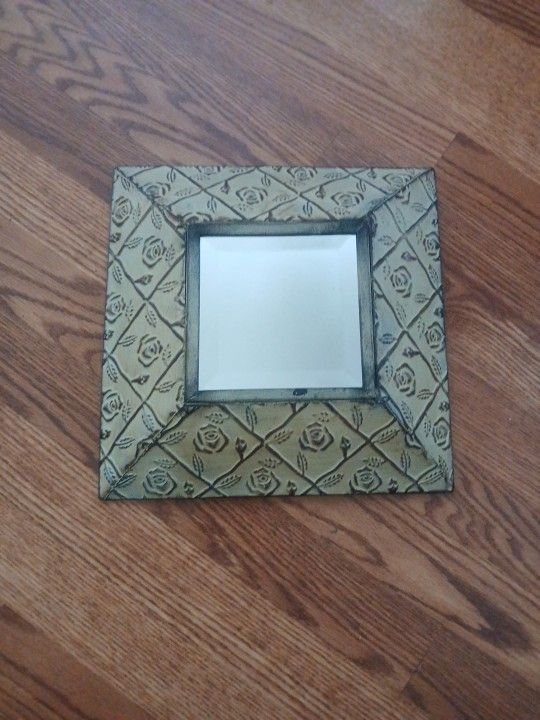 Mirror With Metal Sides And Beige Background With Rose Accents