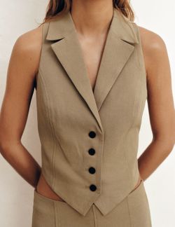 Zara NWT S back cut out vest in camel color. Sleeveless design with v-neck lapel collar. Back opening and tie back. Front button closure. 54% viscose 