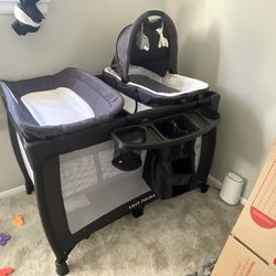 Baby toys and  playpen with changing table and bassinet