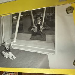 Man diapering baby doll with mechanical hands, 1950s Corbis archives poster