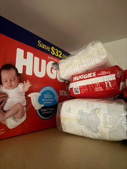 Newborn / Size 1 huggie diapers
