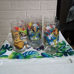 Five 1983 Glass Smurf Cups. One Muppet Cup