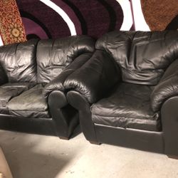 Black leather loveseat and single chair