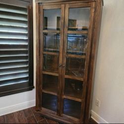 Solid Wood Curio Display Cabinet. Glass doors.  Ashley Furniture 
